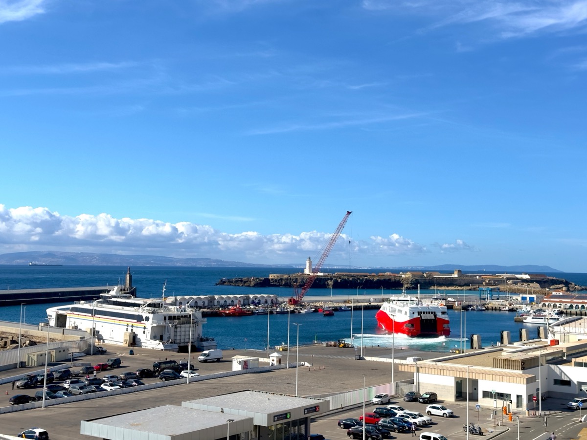 View over Tarifa ferry port with a red high-speed ferry bound for Morocco