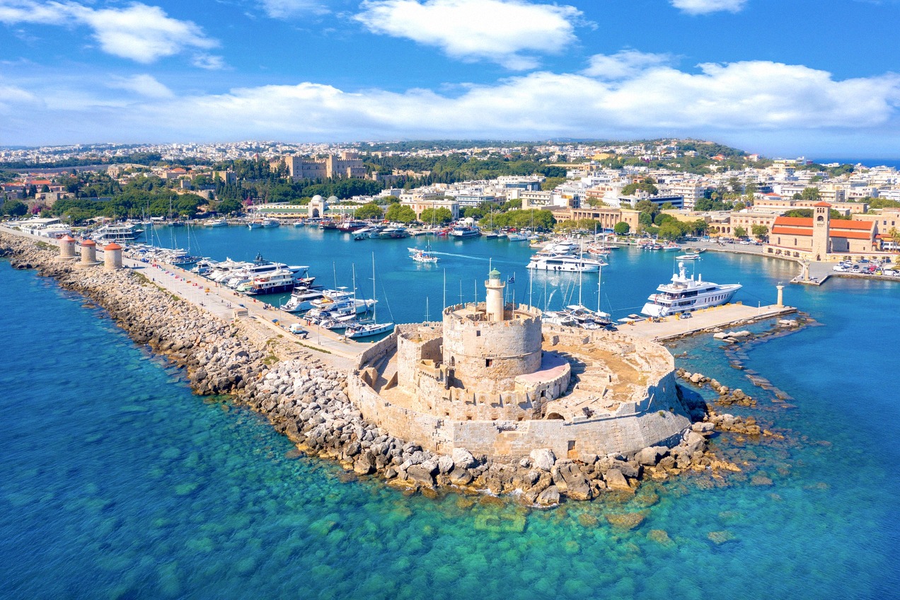 Aerial view of Mandraki harbour in Rhodes with its fort and windmills