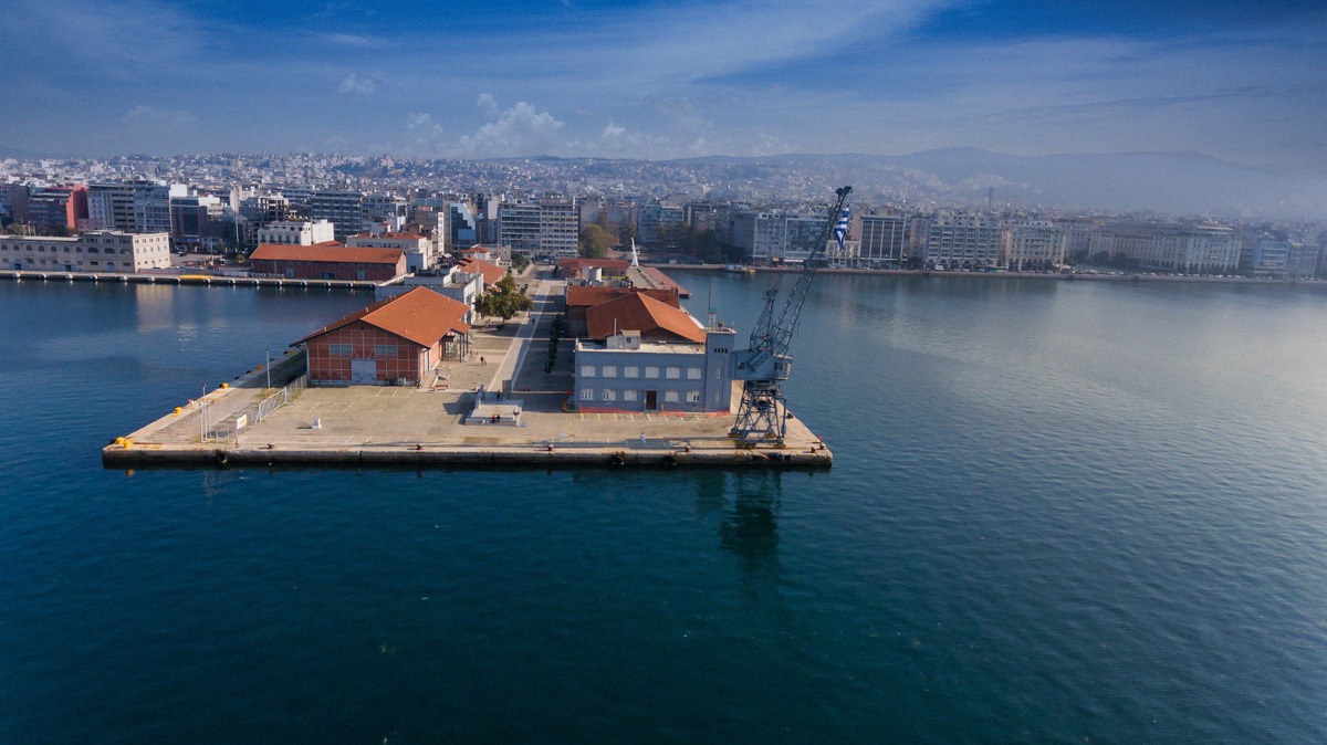 Aerial view of the port of Thessaloniki with its historic pier and brick warehouses