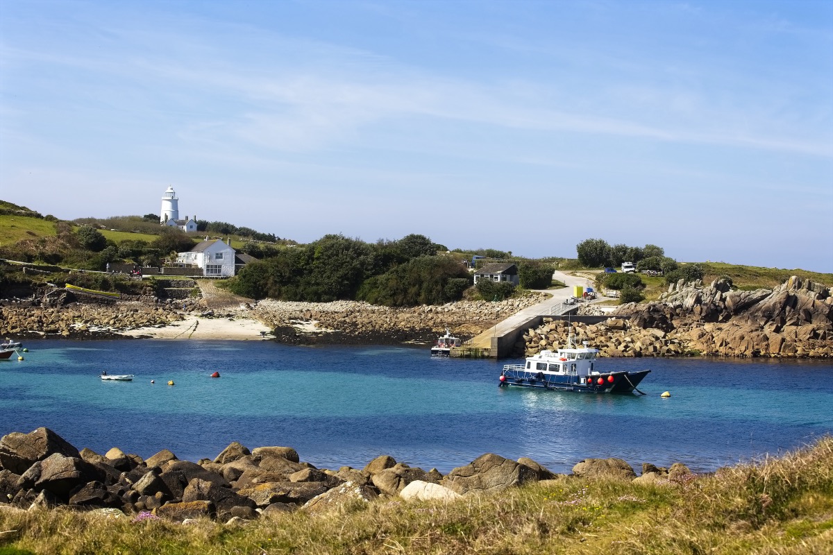 Picturesque bay at Porth Conger on St Agnes, Isles of Scilly, with turquoise water and a rocky coastline