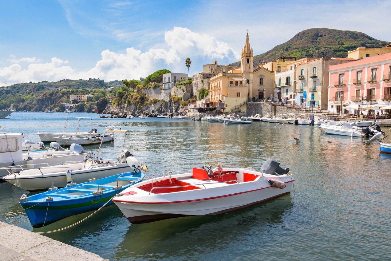 Marina Corta on Lipari with colourful boats and the volcanic hill