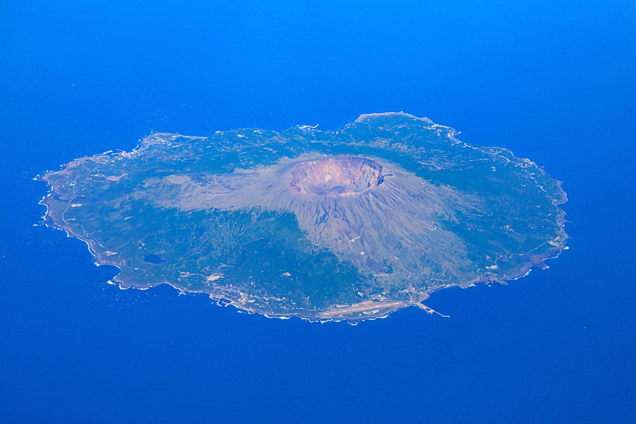 The volcanic island of Miyakejima with the crater of Mount Oyama