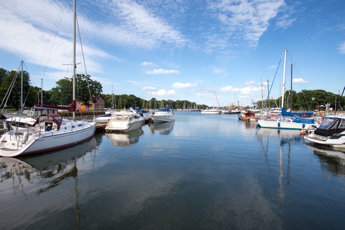 Quiet marina of Świnoujście with sailing yachts and motorboats at the jetties