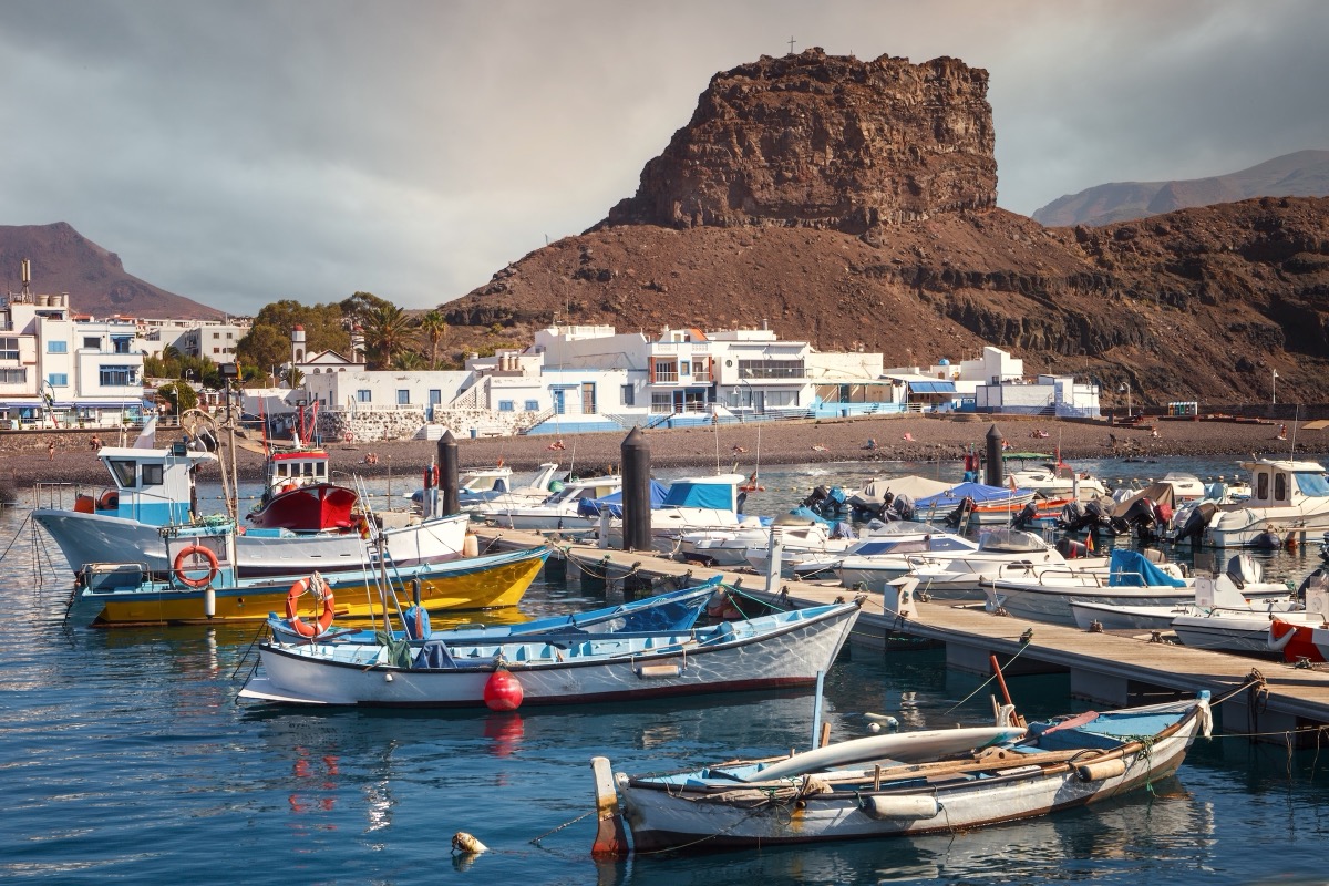 Colorful fishing boats in the port of Agaete on the northwest coast of Gran Canaria