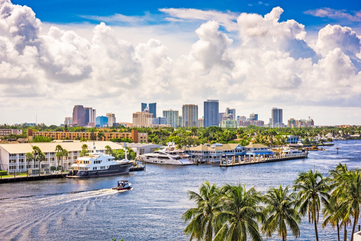 Fort Lauderdale's Intracoastal Waterway with yachts and motorboats in front of the city skyline